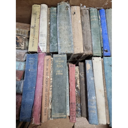 83 - A large quantity in 4 boxes of mostly antique books to include many religious Books, bible, etc, alo... 