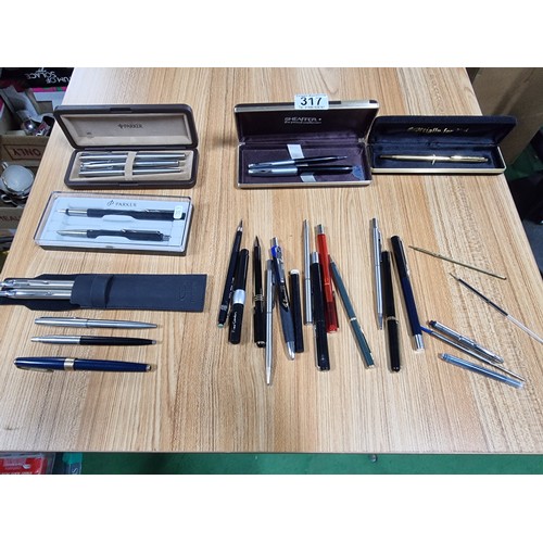 317 - A large quantity of vintage collectable pens to include some good brand names, a cased double pen se... 