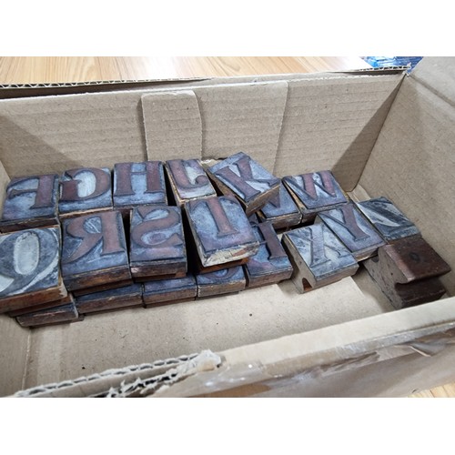 322 - A large quantity of various vintage printing blocks mostly of letters and numbers along with fractio... 