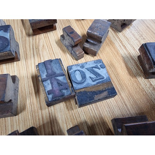 322 - A large quantity of various vintage printing blocks mostly of letters and numbers along with fractio... 