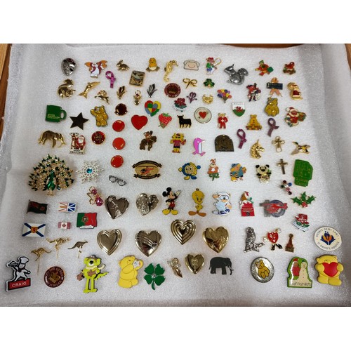 327 - A very large collection of over 100x various pin brooches covering various subjects including Mickey... 