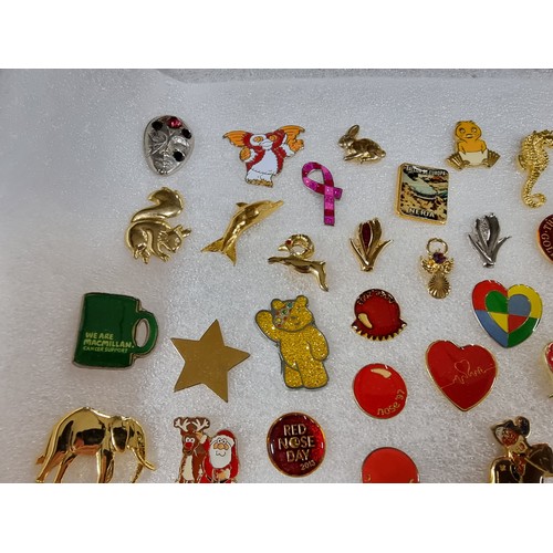 327 - A very large collection of over 100x various pin brooches covering various subjects including Mickey... 