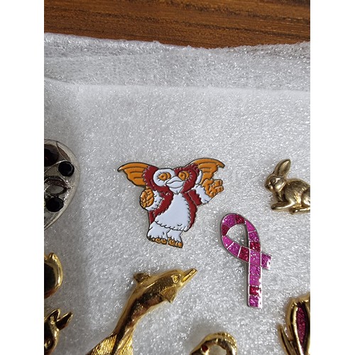 327 - A very large collection of over 100x various pin brooches covering various subjects including Mickey... 