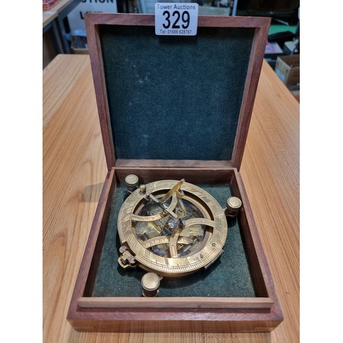 329 - A wooden cased brass sun dial compass by Gilbert&Sons London, fitted in a good quality brass bound w... 