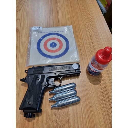 331 - A .177 gas powered BB gun by powerline Japan in good condition with targets and metal BB's included.