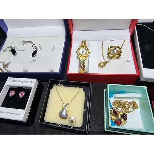 345 - A large quantity of boxed costume jewellery to include ornate dress rings, matching jewellery sets, ... 