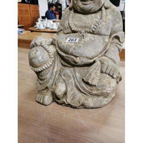 263 - Large concrete Buddha garden figure in good order stands at 43cm high, 29cm wide, 28cm deep