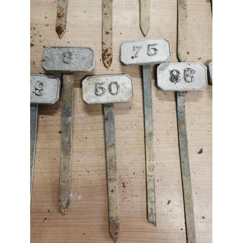 264 - Metal box containing a large quantity of numbered marking pegs for various uses all in good order he... 