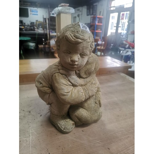 265 - Large garden stone ornament of a boy with his dog in good order stands at 41cm high, 31cm wide