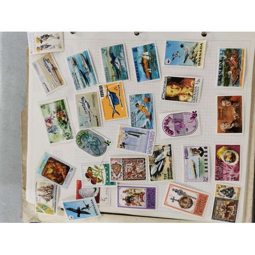 300 - World stamp albums containing stamps along with a quantity of books relating to stamps