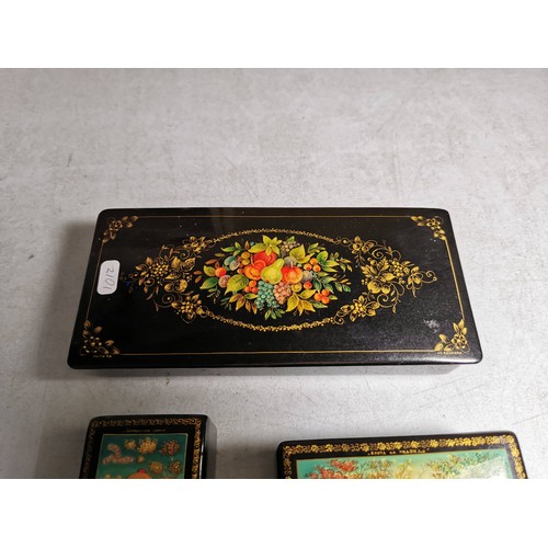 430 - Collection of 3x russian lacquered boxes with nice colourful designs all boxes are signed in Russian... 