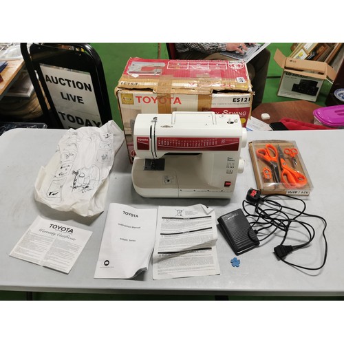 448 - Boxed electric Toyota sewing machine complete with accessories in good order