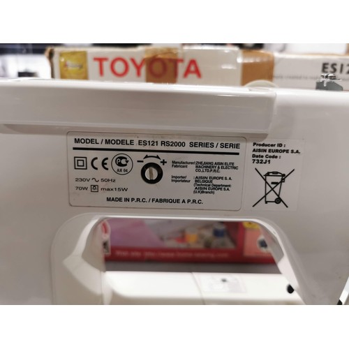 448 - Boxed electric Toyota sewing machine complete with accessories in good order