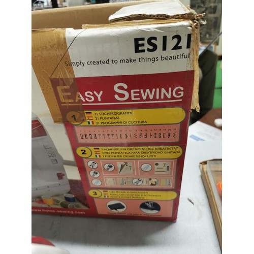 448 - Boxed electric Toyota sewing machine complete with accessories in good order