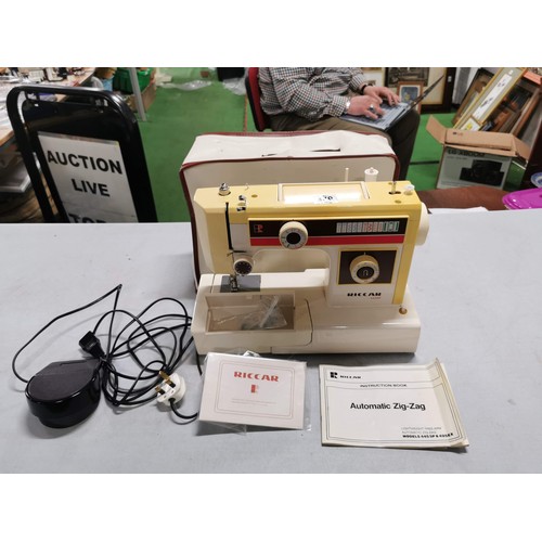 449 - Cased Riccar sewing machine complete with instructions and accessories in good order