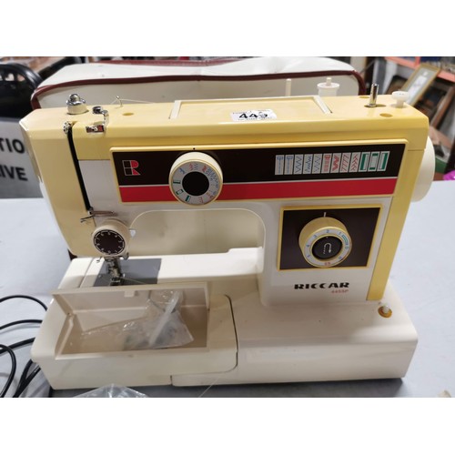 449 - Cased Riccar sewing machine complete with instructions and accessories in good order