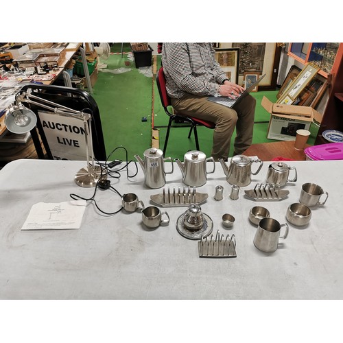 450 - Large quantity of stainless steal teapots, toast racks, jugs etc along with a stainless steel angle ... 