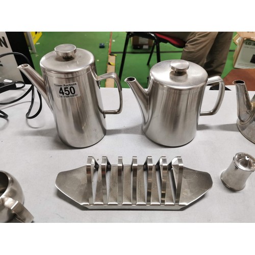 450 - Large quantity of stainless steal teapots, toast racks, jugs etc along with a stainless steel angle ... 