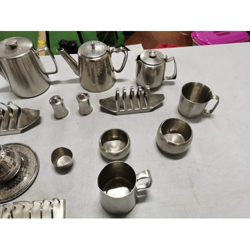 450 - Large quantity of stainless steal teapots, toast racks, jugs etc along with a stainless steel angle ... 