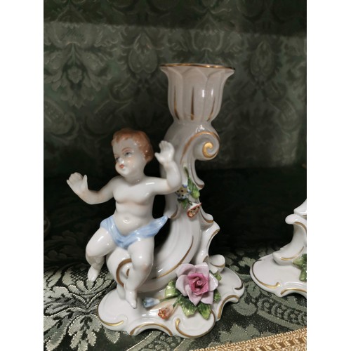 461 - A pair of Capodimonte cherubs candle holders one is AF otherwise in good order stamped to the base, ... 