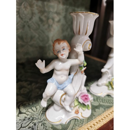 461 - A pair of Capodimonte cherubs candle holders one is AF otherwise in good order stamped to the base, ... 