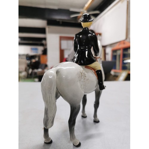 462 - Dappled grey Beswick horse with female rider, stamped underneath, a well done repair to the hind leg... 