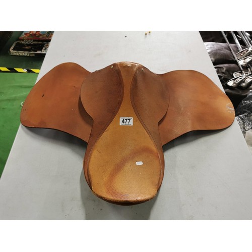 477 - Pale brown leather 15.5in pony saddle complete with padded underside.