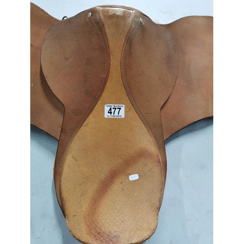 477 - Pale brown leather 15.5in pony saddle complete with padded underside.