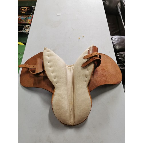 477 - Pale brown leather 15.5in pony saddle complete with padded underside.