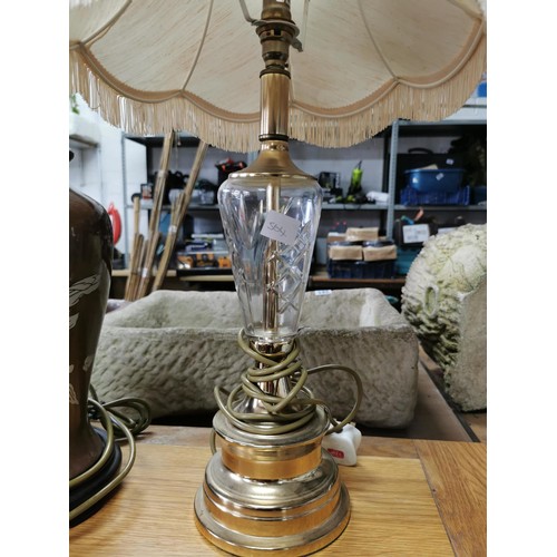 479 - Matching pair of ceramic brown table top lamps with floral design on wooden bases along with brass a... 