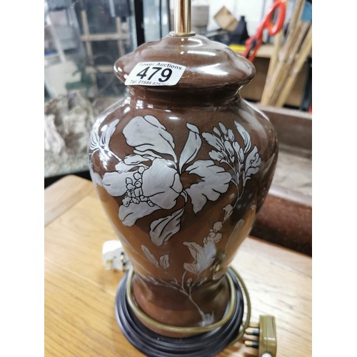 479 - Matching pair of ceramic brown table top lamps with floral design on wooden bases along with brass a... 