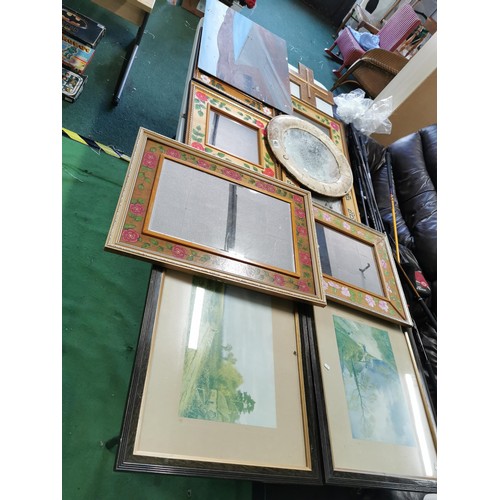 481 - Large quantity of framed mirrors with hand painted design along with a wooden cross and 2x framed an... 