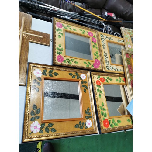 481 - Large quantity of framed mirrors with hand painted design along with a wooden cross and 2x framed an... 