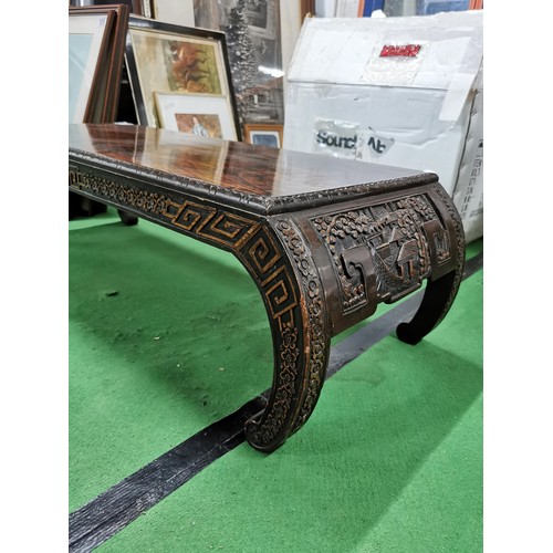 501 - Well carved Chinese camphor wood coffee table, standing on hand carved bow legs in good order, heigh... 