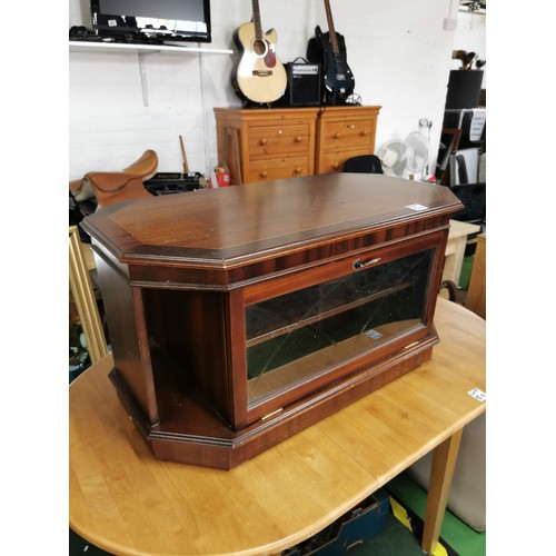 515 - Mid 80's veneered television stand with storage compartments and glazed front