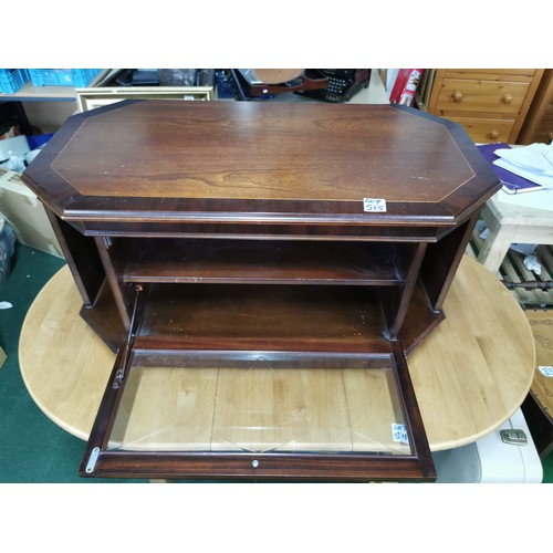 515 - Mid 80's veneered television stand with storage compartments and glazed front