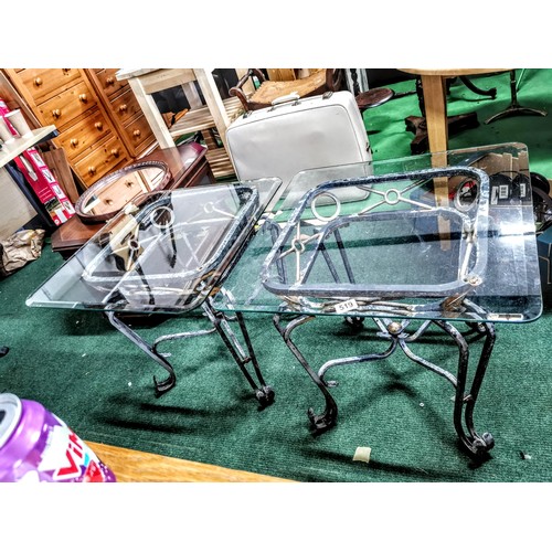 519 - Pair of metal framed glass topped tables in good order with scroll design to the feet, glass tops ar... 