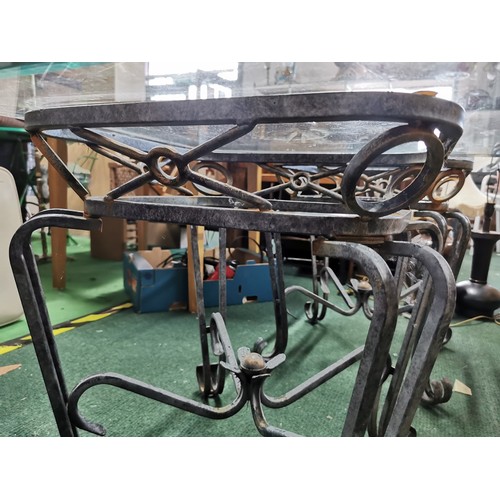 519 - Pair of metal framed glass topped tables in good order with scroll design to the feet, glass tops ar... 