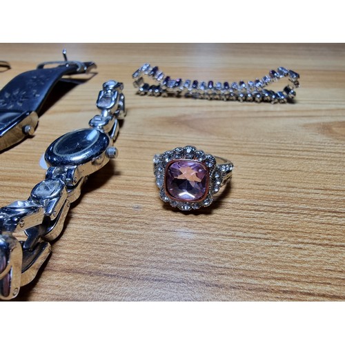 347 - An ornate 925 silver dress ring and a pair 925 silver earrings along with a quantity of watches and ... 