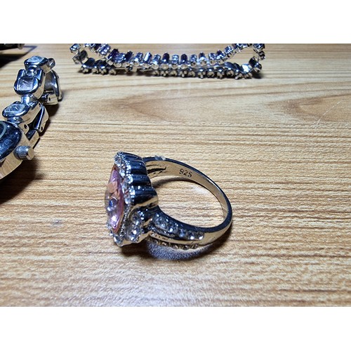 347 - An ornate 925 silver dress ring and a pair 925 silver earrings along with a quantity of watches and ... 