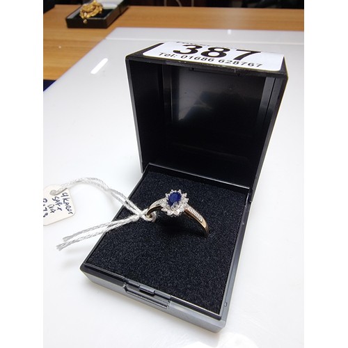 387 - A hallmarked pretty 9ct yellow gold sapphire and diamond ring, total of 0.10ct diamond and approx 0.... 