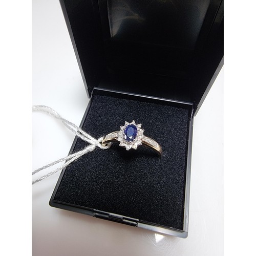 387 - A hallmarked pretty 9ct yellow gold sapphire and diamond ring, total of 0.10ct diamond and approx 0.... 