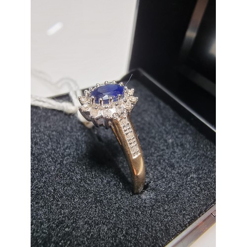 387 - A hallmarked pretty 9ct yellow gold sapphire and diamond ring, total of 0.10ct diamond and approx 0.... 