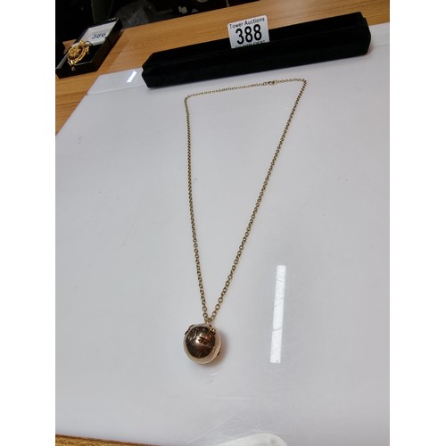 388 - A good quality 9ct gold and silver Victorian Masonic orb ball pendant, which opens up to reveal a cr... 