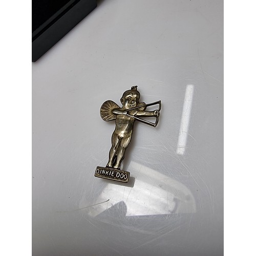 364 - A very rare antique Dinkie Doo pin badge (Dinkie Doo was a car accessory mascot fitted to vehicles o... 