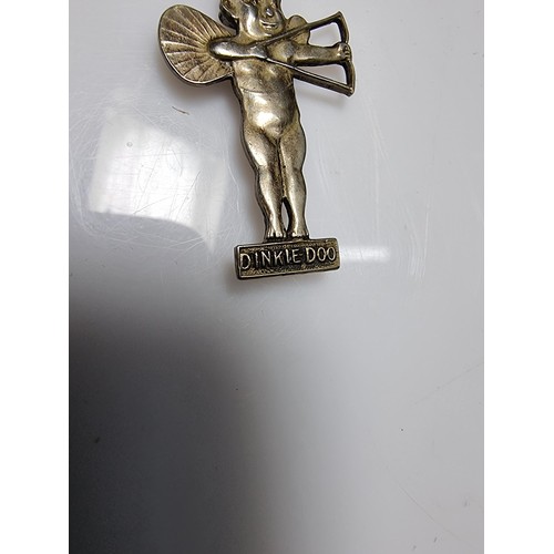 364 - A very rare antique Dinkie Doo pin badge (Dinkie Doo was a car accessory mascot fitted to vehicles o... 