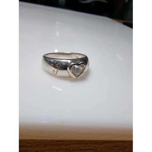 365 - A 925 silver ring with a heart shaped CZ crystal to the centre marked 'I heart you', in good clean c... 