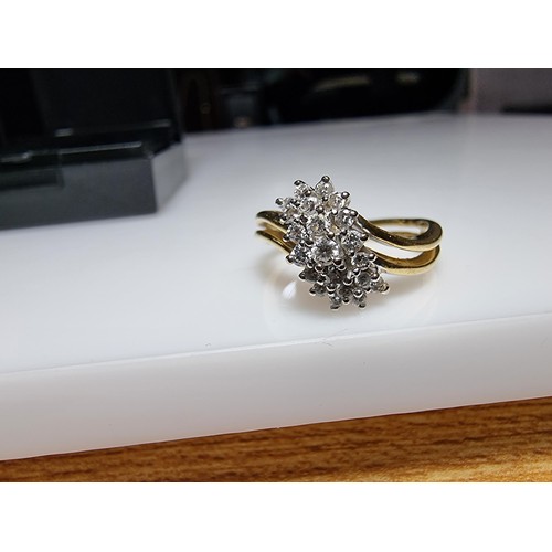 399 - A pretty hallmarked 18ct yellow gold diamond cluster ring, inset with approx 0.350 CT of diamonds wh... 