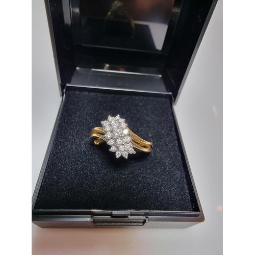 399 - A pretty hallmarked 18ct yellow gold diamond cluster ring, inset with approx 0.350 CT of diamonds wh... 