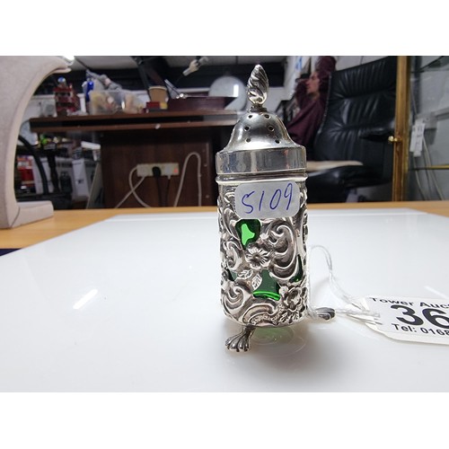 369 - A good quality hallmarked silver salt with an unusual green emerald glass liner with an ornate 
Peir... 